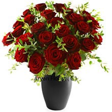 Black Vase containing 30 red roses, looks like they are growing from the vase itself as they are so well placed with greens rightly placed amidst them. Looking at as many as 30 red roses together, your eyes will sparkle and your heart will praise the bouquet. The Vase is also strong and looks perfect in contrast with the red roses. It can be reused after the roses dry up and can adorn your center table. Buy now!