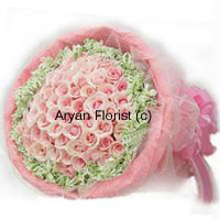 When love is in the air, make it even more visible with this magnificent bunch of 50 pink roses. Wrapped in a beautiful manner with fancy wrapping, fillers are added to the roses to create a heightened effect. Fresh green leaves add to the beauty. The fragrance of the roses is mesmerizing and the overall look of the bouquet is impressively stunning. Let your special one know how much you love him/her.