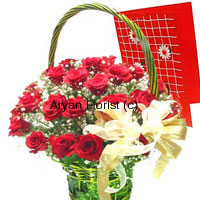 Express every emotion, with red roses and a greeting card. 24 hand-gathered fresh red roses are put together with white seasonal blooms and fillers in a gorgeous green basket. Accompanied by a free greeting card that holds your message, this basket with a sassy golden satin bow is sure to light up everyone's eyes. Easy to carry with the handle of the basket, light in weight, it's elegant design will match with every taste.