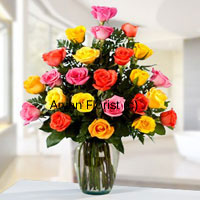 Double up the charm with two-dozen roses in different colours. Bright yellow, charming red, vivacious orange carefully arranged with fresh green leaves and fillers, this bunch is placed in a clear glass vase. The minimal design of the vase heightens the look of the roses further. Easy to carry, easy to display and care for, this one is a perfect gift for personal and business occasions.