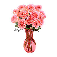 This arrangement is created of 12 pink roses in a fancy glass vase. Each long stem rose is handpicked by our expert florists and arranged carefully. The softness of pink and mesmerizing smell is sure to spread happiness all around. This one is a favourite for baby showers, birthdays and anniversaries. Gift it to friends and loved ones.