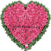 If it's from your heart, let it be in the shape of the heart. A hundred pink roses are put together in the shape of a heart in this bouquet. A border around the heart is created with fresh green leaves. This one looks great when decorated on the wall too. It is put together in a minimal shape, but one that's enough to express your love. This one is a favourite for anniversaries, proposals and even simply a gift-just-to-impress.