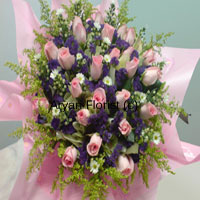 This bunch of 30 pink roses marries elegance with style. The fresh pink blooms are punctuated with equally fresh seasonal fillers. Popping up in between are fresh green leaves. The roses and fillers are creatively surrounded by pink fancy wrapping and bows to add to the dramatic appearance. Unique and elegant, this one is for those who like something different.