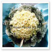 There are few things as pure and soft as white. This bouquet is made of 100 white roses and seasonal fillers. Keeping it simple and classy, the white roses are surrounded by fillers and wrapped with fancy wrapping. Easy to carry and place on any tabletop, this one goes well for business or personal gifting.