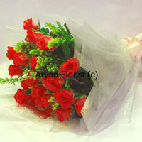 Small is beautiful. And so is this small bunch of 12 red roses arranged with seasonal fillers. Wrapped with translucent wrapping paper and held together with a satin bow, this one is a sweet surprise to express your love, gratitude and happiness for all occasions or simply without any occasion. It's a sweet surprise that will make anyone happy.
