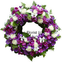 A delicate expression to wish eternal peace, this wreath is created with fresh flowers of various kinds. White, purple, pink and green gently embrace loving memories and offer condolence at a funeral or a prayer meeting.