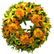 A beautiful wreath made out of mixed flowers in yellow and orange. The flowers are fresh and handpicked and delicately placed. The flowers and greens are set in a classic arrangement that offer consolation during a funeral or a prayer meeting.