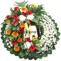 This beautiful wreath created with colourful flowers will evoke memories of brighter days. It is specially designed by our expert florists and decorated with ribbons. The different flowers express different emotions in mourning.