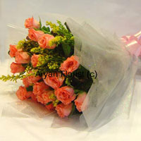 Say it with orange roses! This bunch of 18 orange roses is designed with love and care by our expert florists. Each rose is handpicked, delicately placed in the bunch and seasonal fillers are added to make the bunch look more stunning. Wrapped with fancy sheet all around and held together with a ribbon bow, the arrangement looks fresh, fun and beautiful. Send it to express your love to your spouse on your anniversary and make the day even more special.