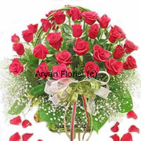 If beauty came in a basket there's only one way it would look. Just like this big basket of 30 red roses. Designed with seasonal fillers and green leaves in a pretty cane basket, this basket has a grandiose look. A perfect present for a wedding, birthday or anniversary celebration, this one is carefully designed to suit all occasions.