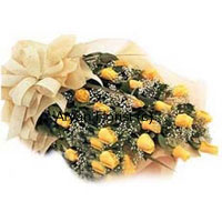 This bouquet of 24 yellow roses as bright as sunshine is bursting of vibrancy. For those who like all things bright and vibrant, this is a perfect arrangement of yellow roses and fillers. The wrapping material and satin bow makes the bouquet look grand and beautiful. Gift it to express get well soon wishes, birthday surprises, engagement and wedding congratulations and more. This bouquet is perfect for all occasions.
