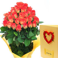 A minimal arrangement with 30 orange roses and green leaves, this one is sure to impress the recipient. The long stem orange roses are fresh and fragrant. The bunch is neatly wrapped with fancy wrapping to create a lovely design. The flowers get delivered with a greeting card that carries your warm wishes. Order this for all celebratory occasions for friends, family and professional contacts too.