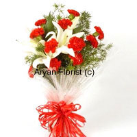 The most impressive arrangement of flowers to send anniversary wishes to friends, family or spouse, the bunch of flowers includes 10 carnations and 2 lilies along with fillers and embellishments. Our expert florists choose the best long stem flowers and design the bouquet with fancy wrapping and ribbons. Place it in a tall vase on any tabletop and it will change the mood of the space to celebratory.