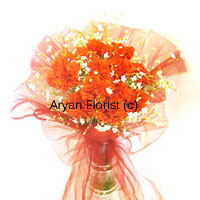 Covered in a beautiful veil, these twelve orange carnations are just like the bride behind the veil, shy yet enthusiastic. Present these beautiful, coy orange flowers put together in a vase, to your bride to be and the love in her eyes will melt your heart. You may also give it to a couple on their wedding as it complements the event and has that special feel to itself that everyone relates to. So place your order now to get it at your doorstep.