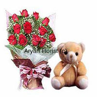 An abundant bouquet with 12 red roses and a small cute teddy bear, this combo absolutely brings a smile to anyone's face. The bouquet is designed with fresh red roses and fillers and wrapped with fancy wrapping. A satin ribbon add on completes the attractive look. The small teddy bear sits cutely by the bouquet. Send this present on birthdays, anniversaries and other occasions.