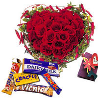 What shouts love more than red roses? A heart-shaped bouquet of 40 red roses. If that's not enough, an assortment of chocolates and a greeting card along with the bouquet. Fresh red roses are stylishly decorated into a heart-shaped bouquet. Fillers, green leaves and decorative add ons and beautify it further more. The chocolates add sweetness and the greeting card carries your message. Order this for the special one.
