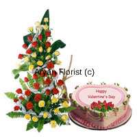 Send this impressive tall arrangement of a 100 red roses and a delicious 1 kg heart-shaped strawberry cake to your beloved. The tall arrangement of roses is delicately created along with fillers and leaves and stands impressively tall. Place it on the floor or a table and it will brighten up any space. The strawberry cake is freshly baked and packed with love.