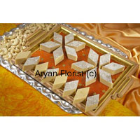 This pack contains 1 Kg Kaju Barfi in a Gift Box is available at a valued price to go for. Kaju Barfi also called Kaju Katli is beautifully arranged in place covered with silver foils wrapped in an eye catching gift box will surely make their day wonderful those are gifted with these special bundle of joy. This light sweet item can be gifted in several occasions and special days as India is a place of diverse festivals.