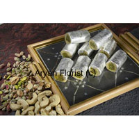 This box consists of 1 Kg Kaju Roll that is another form of Kaju Barfi and is made up of sugar, cashew nuts and ghee morphed in a shape of roll sprinkled with silver foil. This is a famous Indian sweet item that tastes light sweet and is dry by nature. For any sort of small and Big festivals sweets are most welcome. You can undoubtedly present this box along with other gifts and witness the joy in faces of your closed ones.