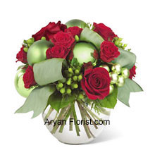 When classic and contemporary get together, we get this beautiful bouquet to enhance the festivities and joy. The classic being the red roses and spray roses and the contemporary being bright green ornaments that elevate the appearance of this very elegant bunch. The arrangement comes in the white colored vase that further compliments the bouquet. Enjoy the very amazing festival with this par excellence arrangement that will indeed uplift your festive moods. (Please Note That We Reserve the Right to Substitute any Product with a Suitable Product of Equal Value in Case of Non-Availability of a Certain Product)