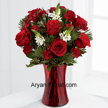 The red colored vase is tailor made for these breathtaking roses and the white blooms that emanate the shine of the stars from the heaven above. This arrangement romanticizes the love for the Almighty and is a warmth galore. Displaying gratitude and spending a wonderful last year and wishing the same for this coming year, this arrangement is just the righteous one to show what you actually feel. Order for this and thank God for everything! (Please Note That We Reserve the Right to Substitute any Product with a Suitable Product of Equal Value in Case of Non-Availability of a Certain Product)