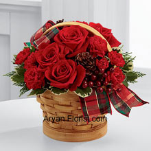 The exemplary red roses that will flush you with scarlet color too, is what you get in this amazing wood chip basket. This basket contains all that you need to enhance your celebrations; it has pine cones reflecting the season's piousness, berry pics that are the addendum to the decor of the bouquet, and needless to mention the affection and warmth of red roses. These are well placed in a basket that is adorned with tartan plaid ribbon that makes it a perfect gift idea. (Please Note That We Reserve the Right to Substitute any Product with a Suitable Product of Equal Value in Case of Non-Availability of a Certain Product)