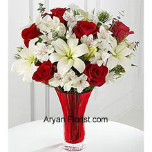 This bouquet is just like the reminder of the onset of the new holiday season for which we have eagerly awaited. The Red roses peep through the bunch of white Asiatic lilies and Peruvian lilies as if it is reminding the warmth that the snow brings with it. This is indeed a paradoxical bouquet of emotions and nature, placed in a red colored vase; telling that God is supreme! With a sense of gratitude and respect, buy this lovely bouquet. (Please Note That We Reserve the Right to Substitute any Product with a Suitable Product of Equal Value in Case of Non-Availability of a Certain Product)