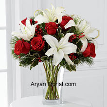 Begin this season by buying Rich red roses that are mingled with white Oriental lilies. The assorted holiday greens and variegated holly stems that are placed in this arrangement are a sumptuous treat for the eye. Further put together in a clear glass vase, this arrangement is indeed a great way to wish season's greetings and best wishes. Why delay, place an order to wish others or for self, this will bring the season to a melodious start! (Please Note That We Reserve the Right to Substitute any Product with a Suitable Product of Equal Value in Case of Non-Availability of a Certain Product)