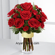 What Rich Red roses create, no other can!! To supplement your wishes, send this heartfelt collection of Rich red roses and spray roses that are offset by burgundy mini carnations, variegated holly stems, and assorted holiday greens. This pretty red arrangement is showing warmth, affection, and sentiments that are pure. This, arranged in a clear glass gold banded vase makes the festival even more special and memorable for the receiver and sender both. (Please Note That We Reserve the Right to Substitute any Product with a Suitable Product of Equal Value in Case of Non-Availability of a Certain Product)