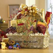 Hues of golden are often attractive, and so is this lovely off-white basket that holds superbly packed Dutch Gouda Cheese Biscuits, Crantastic Snack Mix, Chocolate Cocoa, Scottish Shortbread Fingers, Roasted Peanuts, assorted Godiva Dark Chocolates, Smoky Cheddar, Fancy Water Crackers, Swedish Ballerina Cookies, Holiday Mints, Bellagio Caramella Coffee, Christmas Tea, and non-alcoholic Sparkling Apple Cider in sparkling golden wrapper. This glittering golden packs of sweet and savory items are the best to indulge into on festive days. (Please Note That We Reserve the Right to Substitute any Product with a Suitable Product of Equal Value in Case of Non-Availability of a Certain Product)