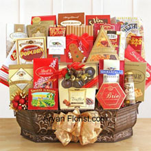 This gourmet collection is the crowne jewel that we create for stupendous people who live life king size. This wonderful motto is in perfect alignment to the sizeable, majestic goodies that succeed in creating lasting impressions. This reusable metal container is replete with Jacquot truffles, Harry & David's Moose Munch, Berry bon bons, Sonoma biscotti, chocolate chip cookies, Bellagio hot cocoa, holiday cookies, Ghirardelli chocolate squares, Cashew Roca, bruschetta toast, Brie cheese, olives, merlot cheddar cheese, smoked salmon, sesame crackers, classic water crackers, and a box of Le Grand truffles. (All these products are subject to availability and are replaced with goodies of equal value).